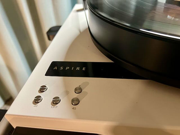  112525.apcafshow.jsikoraaspirelogoontable.jpg